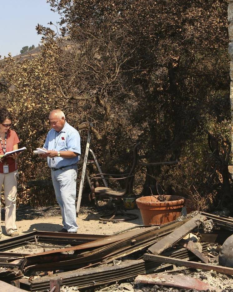 Officials tallying damage at a fire-destroyed home