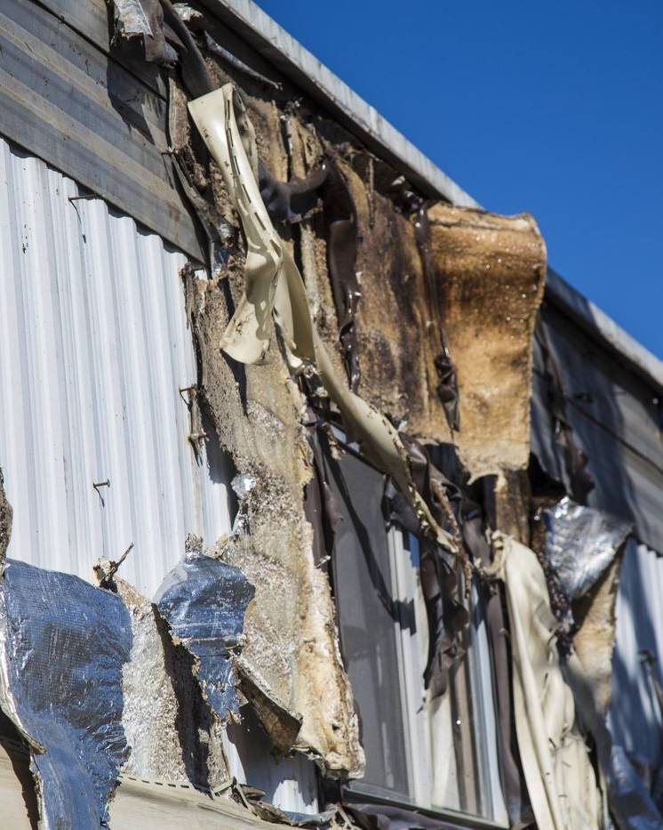 Close-up of scorched siding after a house fire