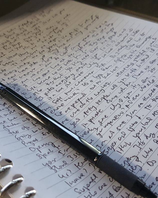 Handwritten notes in an open notebook