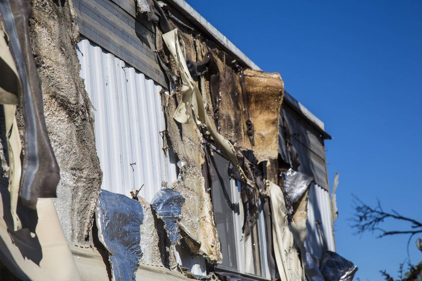 Close-up of scorched siding after a house fire