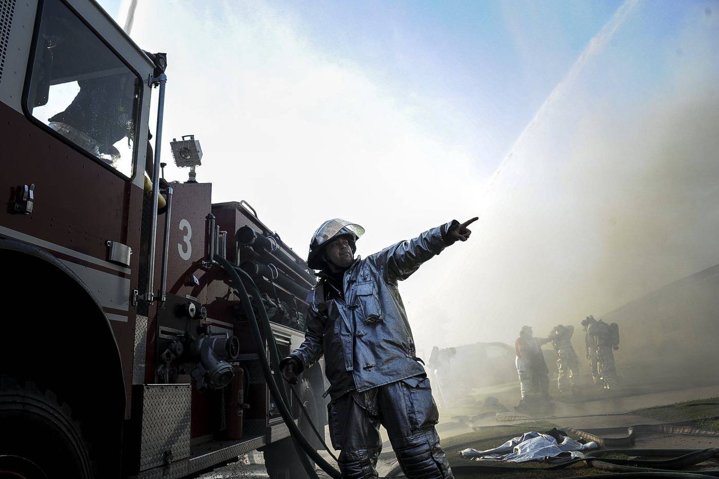 Firefighters working at the scene of a house fire