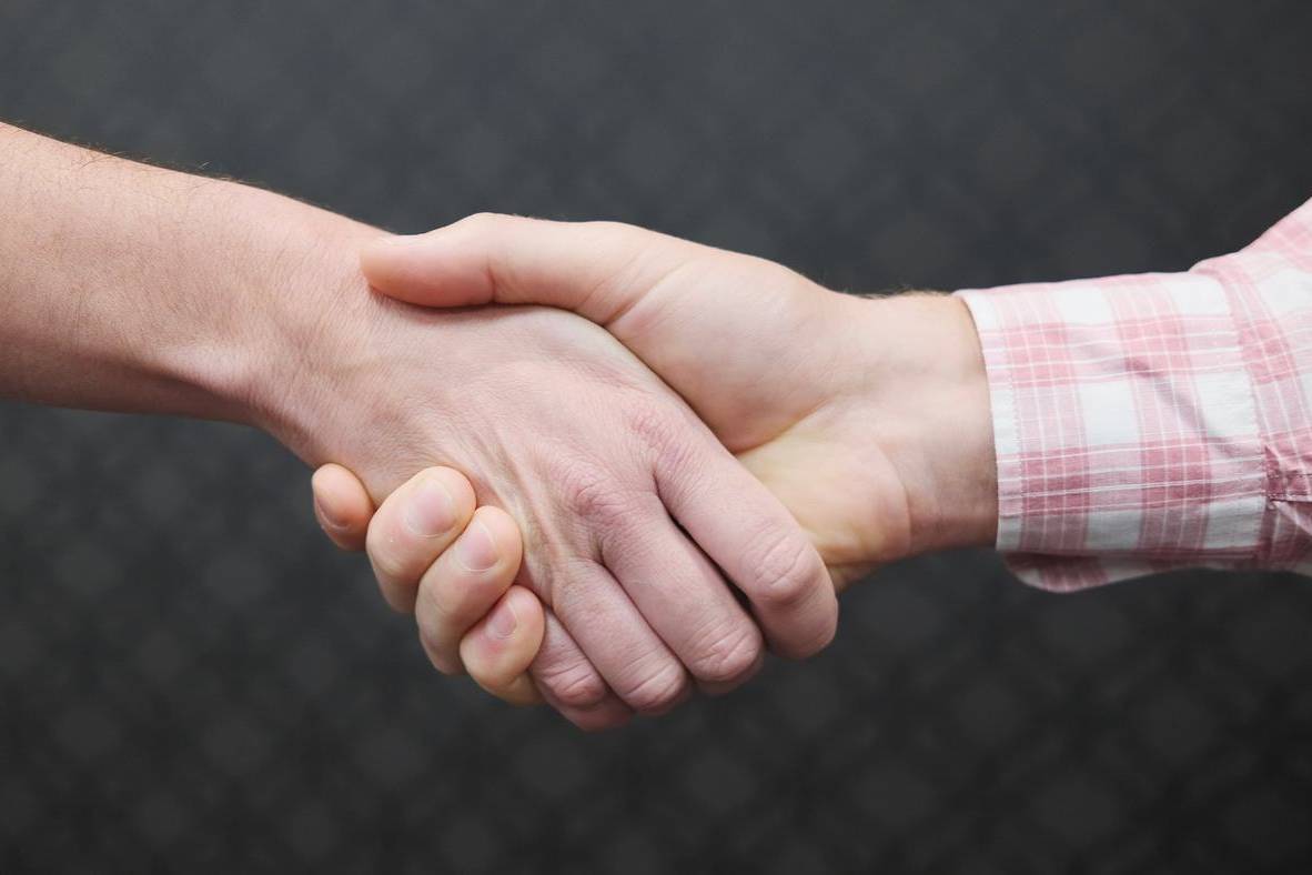 Two people shaking hands