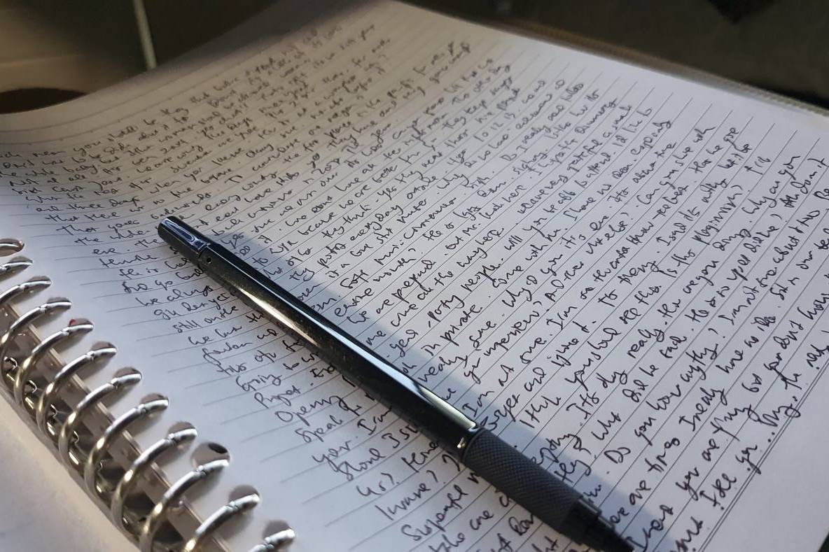 Handwritten notes in an open notebook